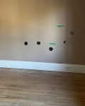 empty brown bedroom with wood floor before remodel