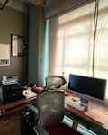 Grayish green office before remodel