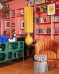 colorful living room with floor to ceiling coral shelves