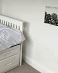 White walls in bedroom before adding wallpaper.