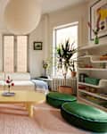 White living room space with colorful furniture