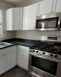 Gray kitchen space before renovation