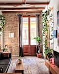 Door to Juliet balcony in living room of historic apartment.