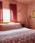 Pink bedroom with pink floral bed