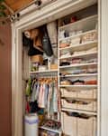 Children's clothes neatly organized in closet.