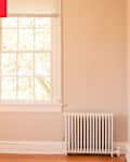 Empty room with radiator in corner