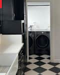 White and black basic kitchen with checkered floor before makeover