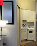 Kitchen in studio apartment.