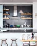 an industrial style kitchen with sturdy appliances