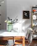 Dishware and linens on etagere.