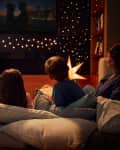 Family watching movie in home theater.