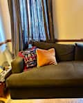 Olive Green Quince sofa in living room.