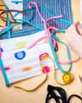 Using a sewing machine to sew a face mask during the coronavirus pandemic
