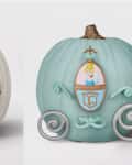 White pumpkin with Jack Skellington face and blue pumpkin styled as Cinderella's carriage.