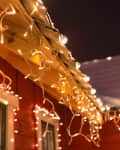 Christmas lights hanging from roof