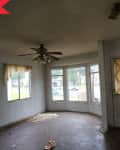 Before: Dark and dated dining room with bay window