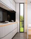 Interior of kitchen with lots of curved lines in tiny home