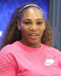 Tennis player in a pink Nike shirt at the US Open press event.