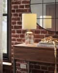 Clear target lamp on coffee table.