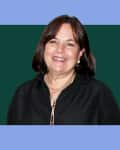 headshot of Ina Garten on a colored background