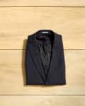 Overhead shot of a folded suit jacket.