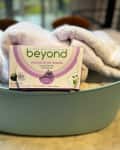 Beyond Natural Dryer Sheets sitting with some towels on a table