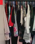 Closet before decluttering using the one in one out method.
