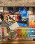 Medicines in kitchen drawer before reorganizing.