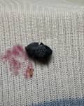 Blueberry stained on sweater.