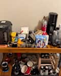 Messy kitchen coffee area.