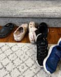 Shoes scattered on floor.