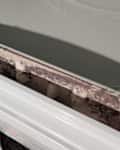 Linen in dryer linen trap before cleaning.