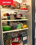 A cluttered refrigerator filled with various food items, condiments, and drinks, including fruits, jars, and containers.