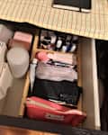Toiletries organized in drawer.