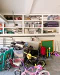 Before: kids toys and bikes  on the garage floor