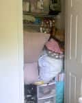Cluttered linen closet before organizing