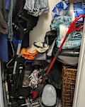 Pro organizer helps with messy utility closet.