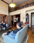 Couple sitting in living room before remodel.