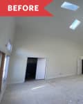 Spacious empty room with high ceiling, skylights, ceiling fan, and chandelier, labeled "Before" in red.