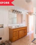 Bathroom with wooden vanity, large mirror, shower stall, and visible renovation debris on the floor.