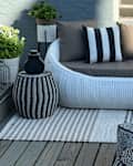 Woven Rattan Round 75.2" Outdoor Sofa on a porch.