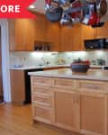 Before: a builder grade kitchen with wood cabinets and floors plus pots and pans hanging above the kitchen island