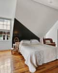 bedroom by Maureen Stevens design with a painted accent wall