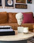 Danielle Blundell Living room with a tan Article sofa and gallery wall