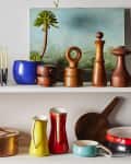 Colorful Dansk vintage pieces styled out on a shelf in a modern context