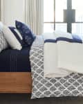 Bedroom styled in Everhome blue and white linens