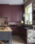 Kitchen of Sophie Donelson with cranberry cabinetry and a blue-grey island