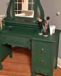 Green vanity with green paint an brass hardware before renvovation.