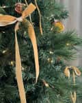 Christmas tree with hand-tied gold velvet bows