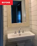 Small bathroom with a white sink, a large mirror with a textured frame, and a shelf with a woven basket.